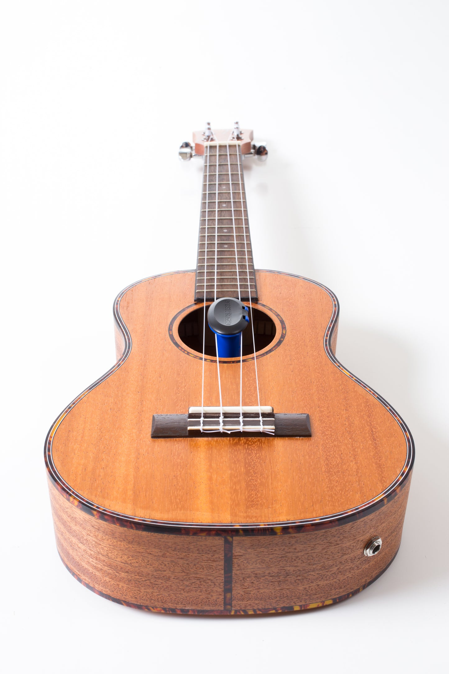 MUSICNOMAD MN302 HUMILILE HUMIDIFIER INSIDE UKULELE SOUND HOLD ON WHITE BACKGROUND