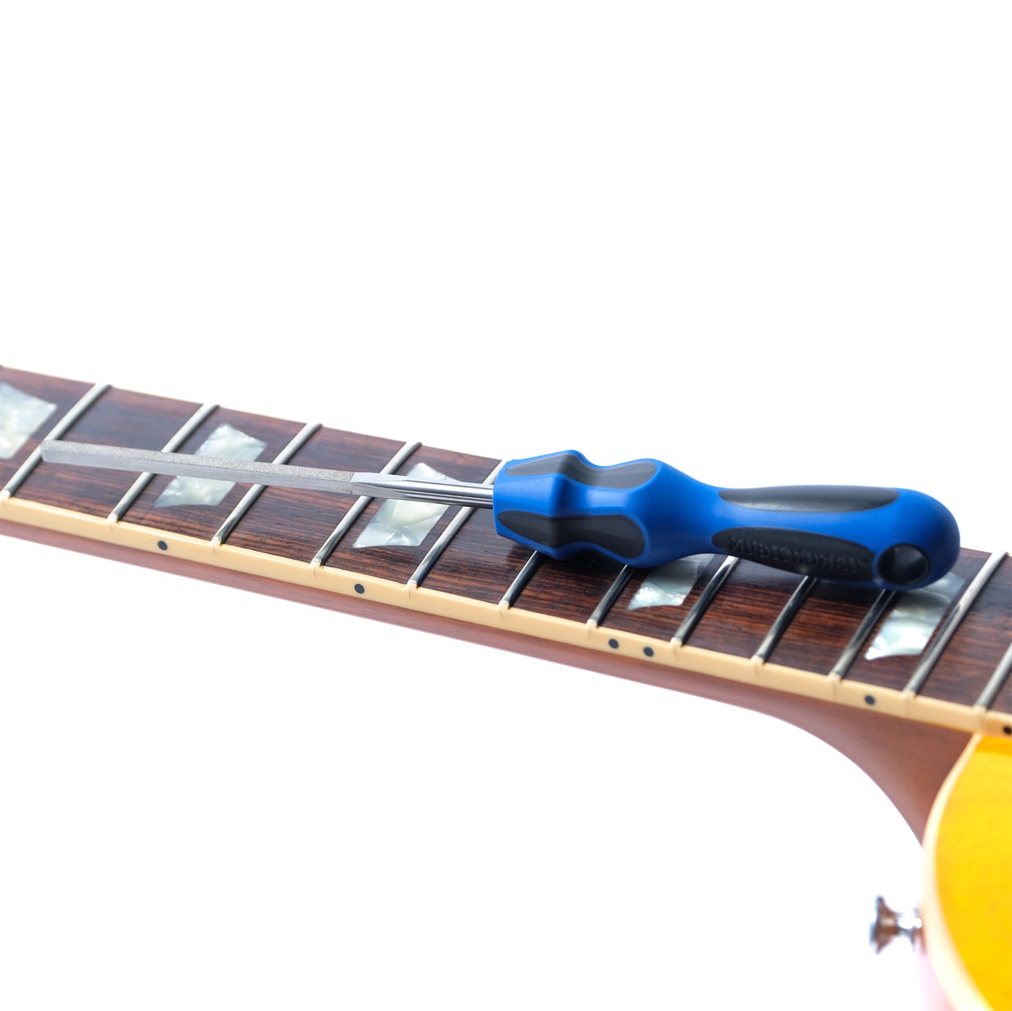 MUSIC NOMAD MN830 FRET END DRESSING FILE LAYING ON FRETBOARD OF ELECTRIC GUITAR ON WHITE BACKGROUND