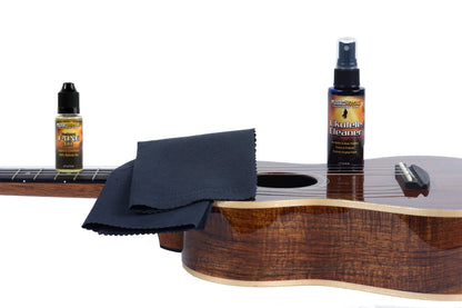 MusicNomad  MN142 BOTTLE AND FONE OIL AND CLOTH ON ACOUSTIC GUITAR ON WHITE BACKGROUND